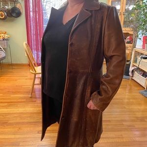 Brown leather coat.